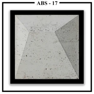 A large, square Luxture Abstract ABS-17 wall panel with an asymmetrical pyramid design and a rough, pitted texture.