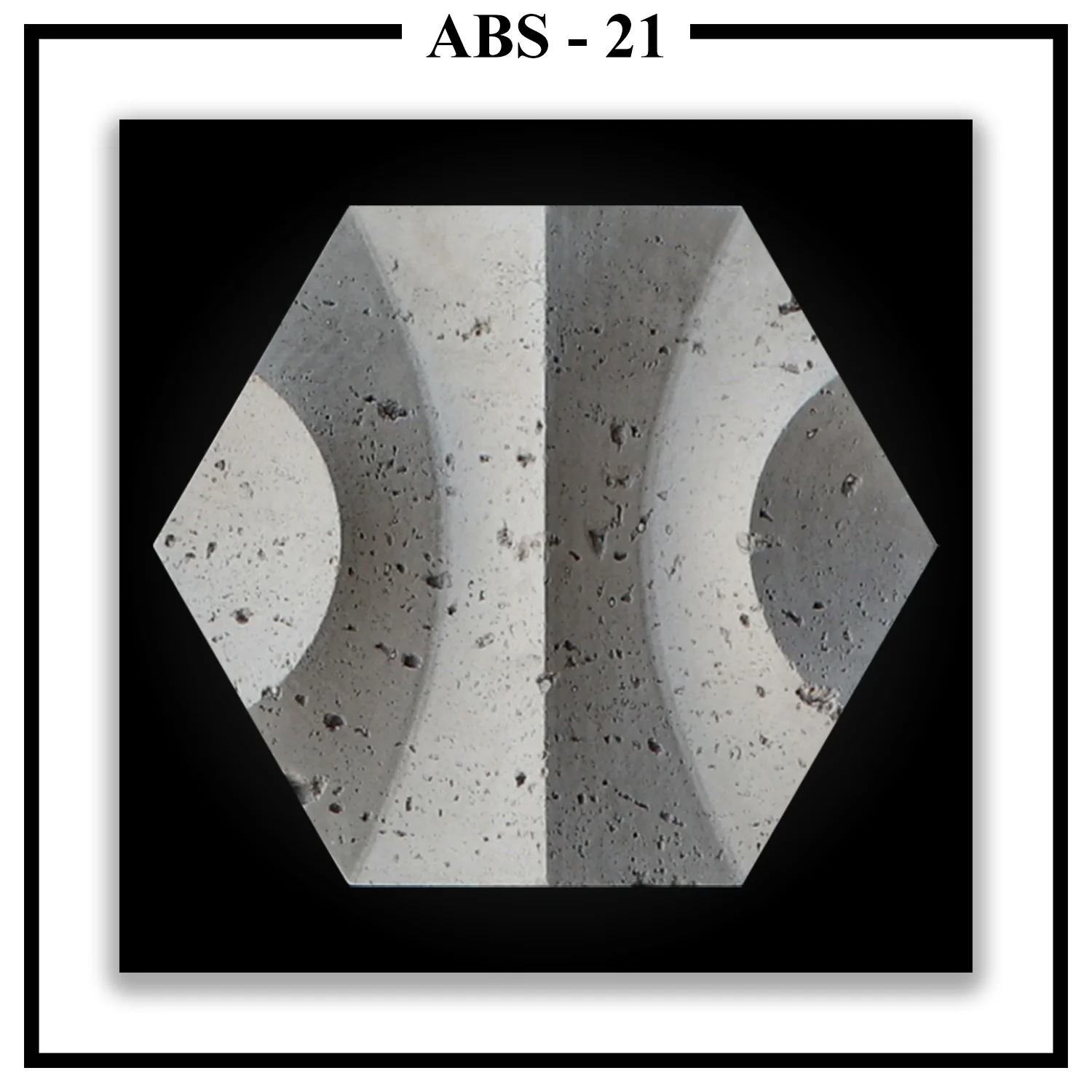 A single Luxture Abstract ABS-21 hexagonal panel featuring two large opposing concave curves and a rough, pitted texture.
