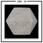 A Luxture Abstract ABS-10 hexagonal wall panel featuring a subtly beveled edge and a porous, travertine-like texture.