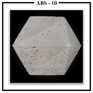 A Luxture Abstract ABS-10 hexagonal wall panel featuring a subtly beveled edge and a porous, travertine-like texture.