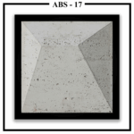 A large, square Luxture Abstract ABS-17 wall panel with an asymmetrical pyramid design and a rough, pitted texture.