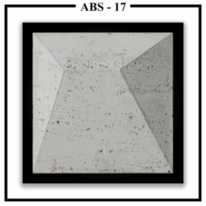 A large, square Luxture Abstract ABS-17 wall panel with an asymmetrical pyramid design and a rough, pitted texture.