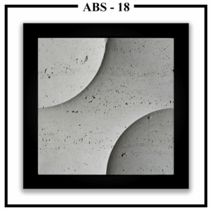 A close-up of a square Luxture Abstract ABS-18 wall panel with two opposing curves and a rough, travertine-like texture.