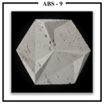 A single Luxture Abstract ABS-9 hexagonal wall tile with a faceted design and a rough, pitted travertine texture.