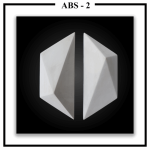 Two separate Luxture Abstract ABS-2 wall tiles with crystal-like facets against a black background.