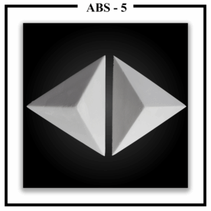 Two Luxture Abstract ABS-5 triangular pyramid 3D wall tiles placed point-to-point against a black background.